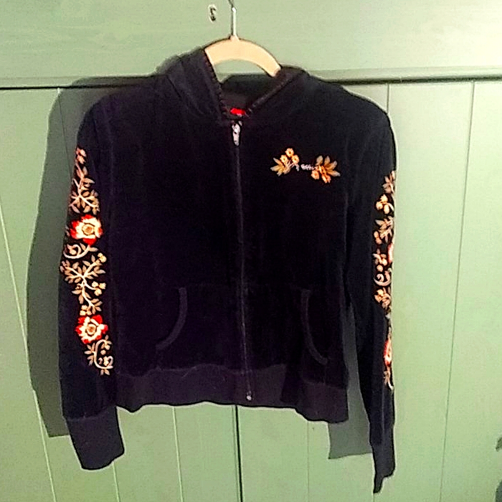 Black velour hoodie with embellishment.